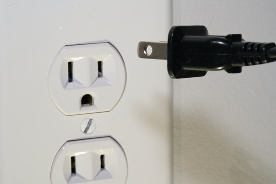 two outlets and a plug to be inserted in the outlet