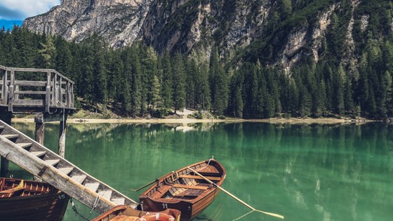 calm sea with a boat floating at the seaside